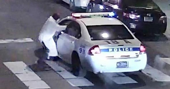 Philadelphia Police Department image of a gunman approaching a Philadelphia Police vehicle in which Officer Jesse Hartnett was shot shortly before midnight in Philadelphia Pennsylvania