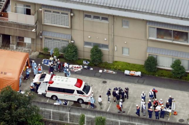 Police officers and rescue workers are seen in a facility for the disabled, where at least 19 people were killed and as many as 20 wounded by a knife-wielding man, in Sagamihara, Kanagawa prefecture, Japan, in this photo taken by Kyodo July 26, 2016. Mandatory credit Kyodo/via REUTERS