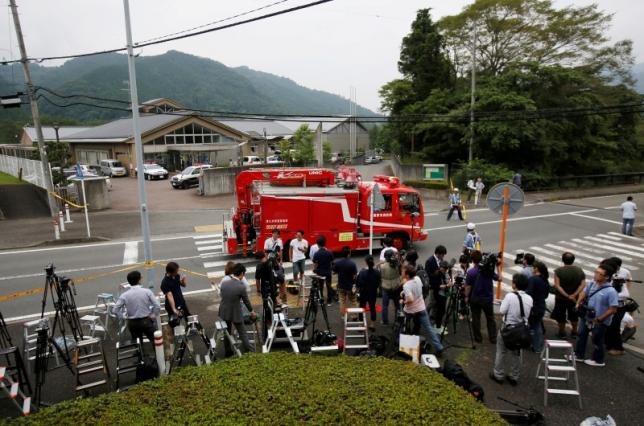 A firefigters' rescue unit car drives in front of a facility for the disabled, where a deadly attack by a knife-wielding man took place, in Sagamihara, Kanagawa prefecture, Japan, July 16, 2016. REUTERS/Issei Kato