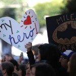 Fans of leukemia survivor Miles, aka “Batkid”, hold signs as part of a day arranged by the Make-A-Wish Foundation in San Francisco